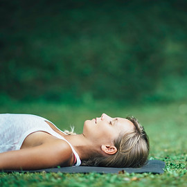 Girl doing yoga, meditating, Shavasana o