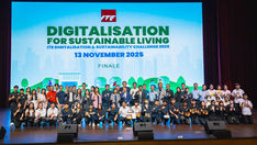 A large group of students, educators, and industry representatives pose on a stage during the ITE Digitalisation & Sustainability Challenge 2025 finale.