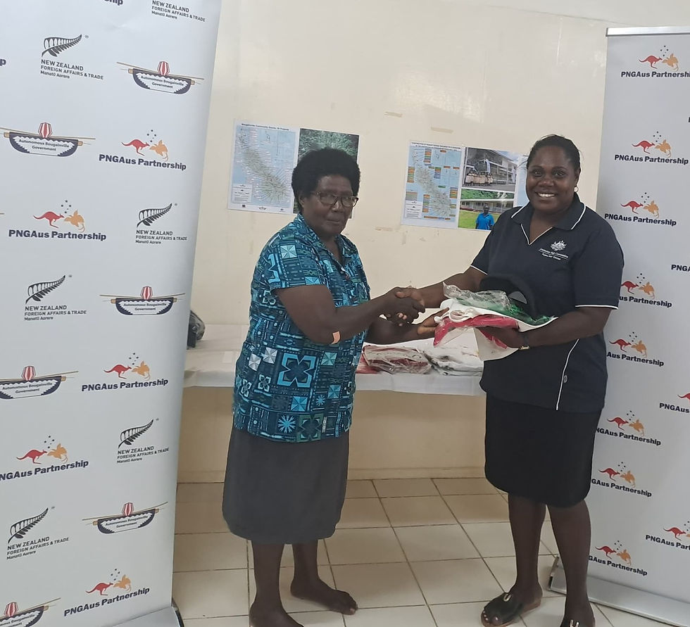 DFAT Assistant Program Manager Joanita Lesi (R) officially hands over the BWF Merchandise to BWF Vice President Hellen Siumana at Abt Bougainville Partnership's Office - Hutjena