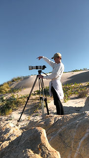 filming on beach surfing blend media