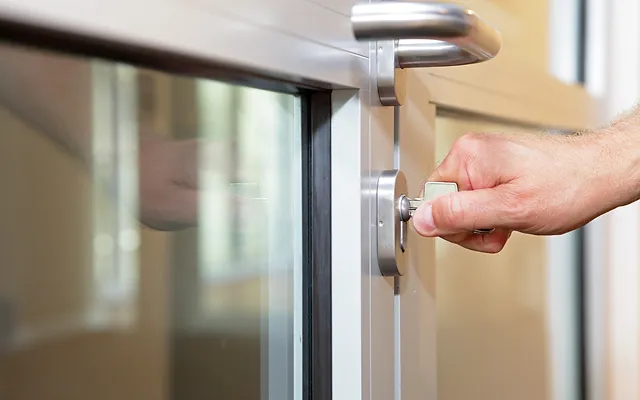 Teamwork Locksmith Seguin technician working on a commercial door lock