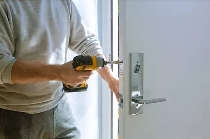 Emergency locksmith from Teamwork Locksmith Inc. attending to a lockout situation