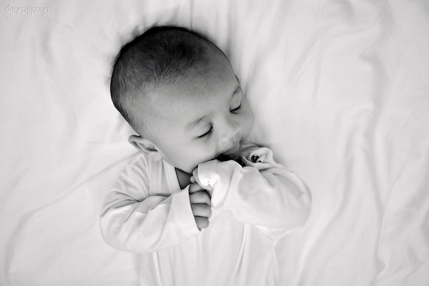 Baby wearing our Hypoallergenic Bamboo Sleepsuit