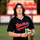 Senior boy wearing baseball jersey and glove at Lake Mary High School baseball field
