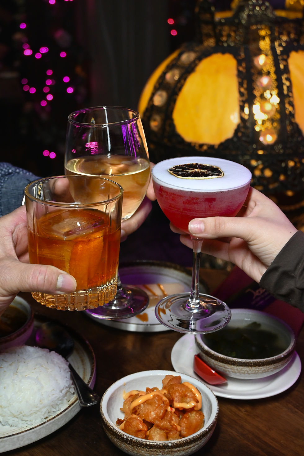 uests toasting with happy hour cocktails and Asian fusion bites at Jade Eatery & Lounge, Hicksville.