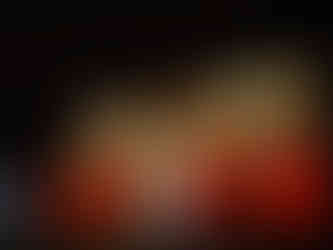 Light display of snowflakes on building