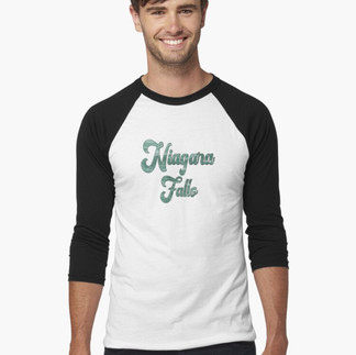 Male wearing raglan baseball tshirt with the Word Niagara Falls in emerald green, the color of the Niagara River
