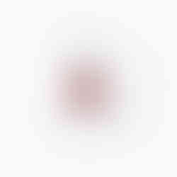 White mug with a red maple leaf and the word Canada outside the leaf