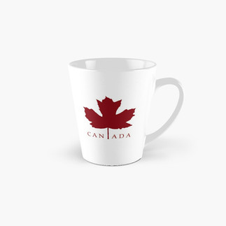 White mug with a red maple leaf and the word Canada outside the leaf