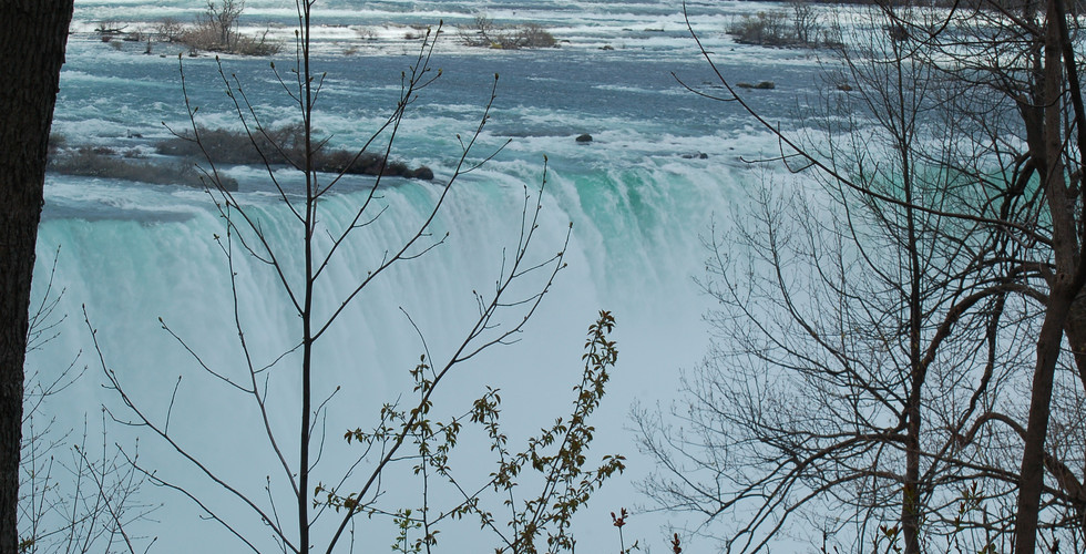 Waterfalls view through the trees