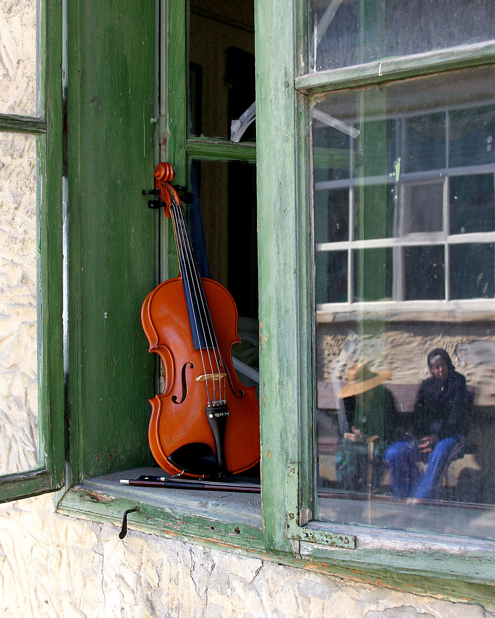 Violin in Window in Romania