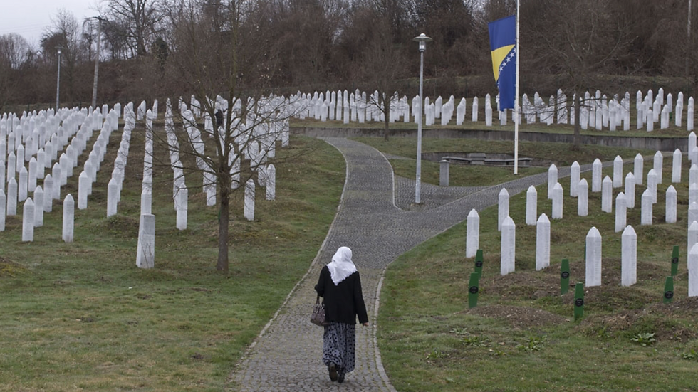 A woman walks through the cemetery in Potocari, Bosnia and Herzegovina, Wednesday, March 20, 2019 [Marko Drobnjakovic/AP]