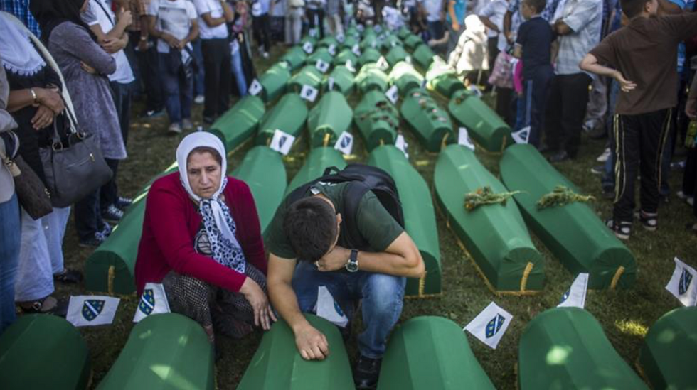 Family members mourn at the mass funeral for newly-identified victims of the 1995 Srebrenica genocide [File: Matej Divizna/Getty Images]