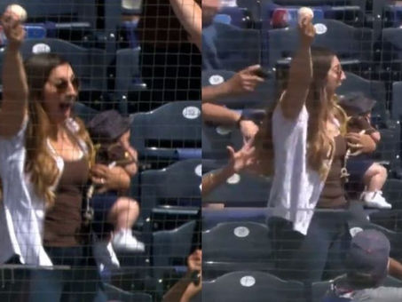 ¡MVP! Madre atrapa pelota de béisbol con bebé en brazo (VIDEO)