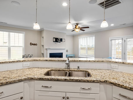 Recessed lighting, pendant lights and a ceiling fan in a single-family home, interior lighting installation