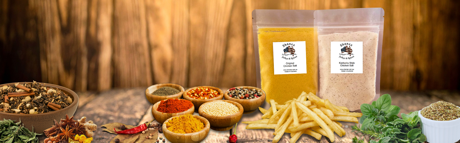 Herbs, spices and chicken salts on a rustic wooden table from Shanez Jerkyz and Spicez
