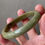Thumbnail: 57.6MM Type A Greenish Brown Mix Jadeite Bangle