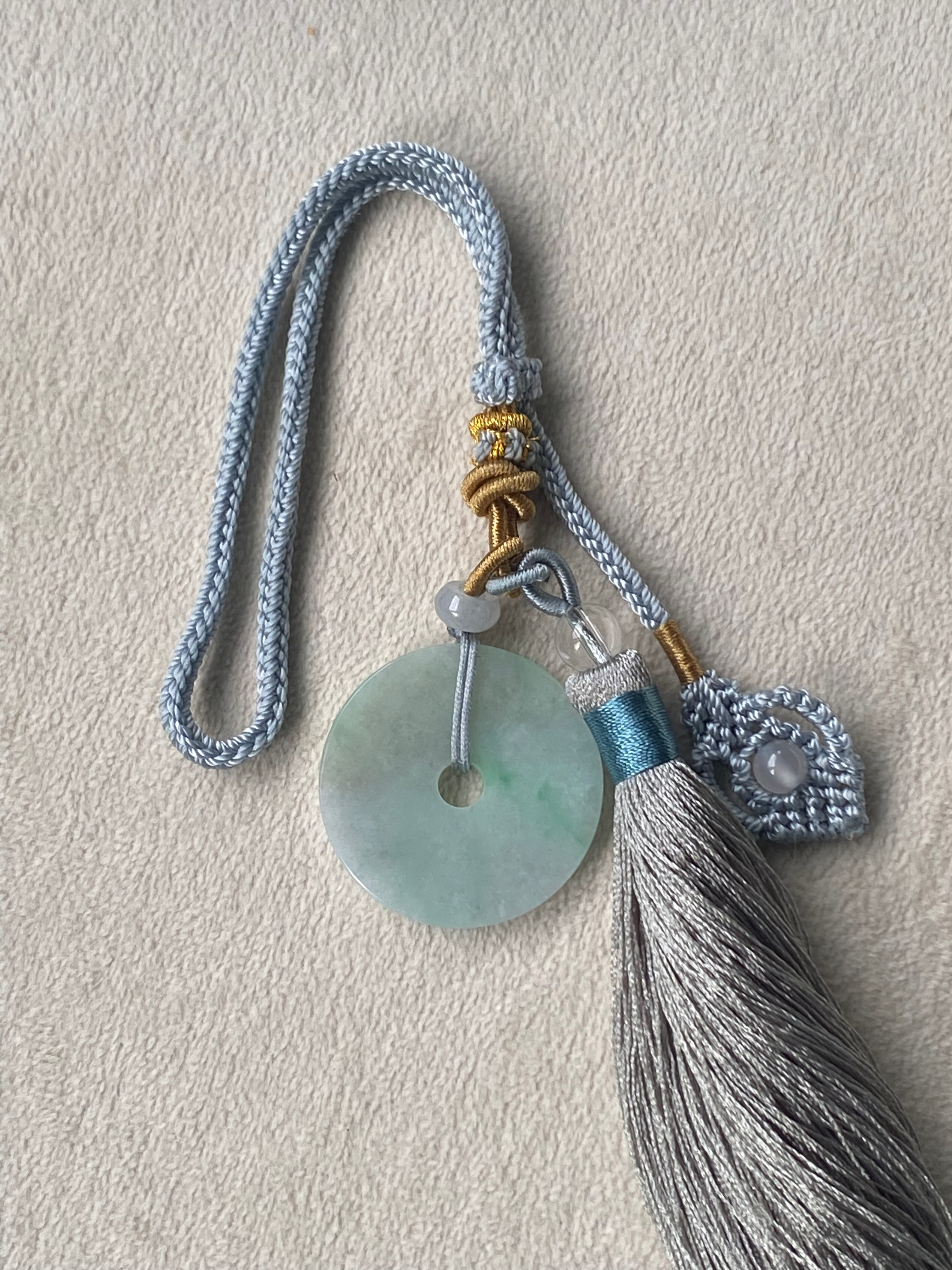 Type A Faint Green Carved Jadeite Coin