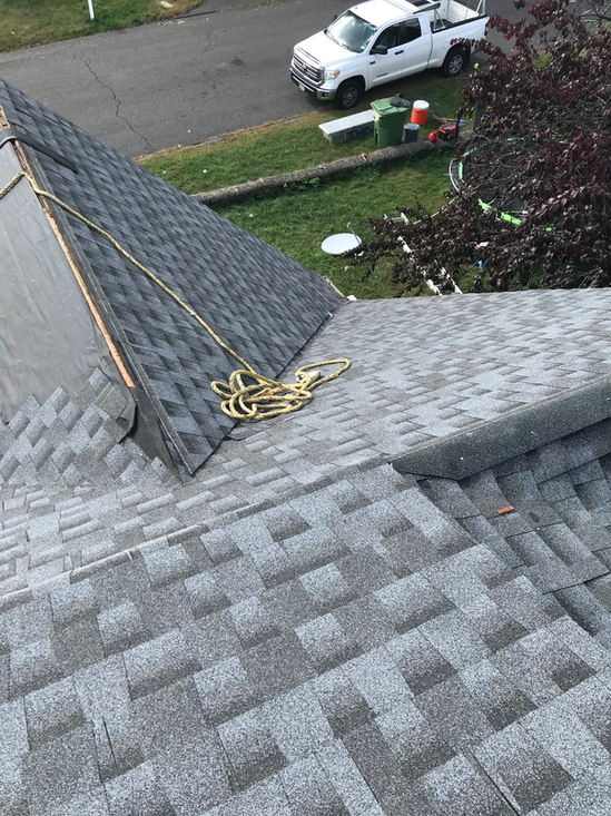 New shingle roof installed by Shaping Houses LLC.