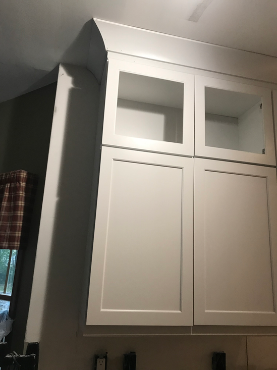 Kitchen cabinet installation. White cabinets. 