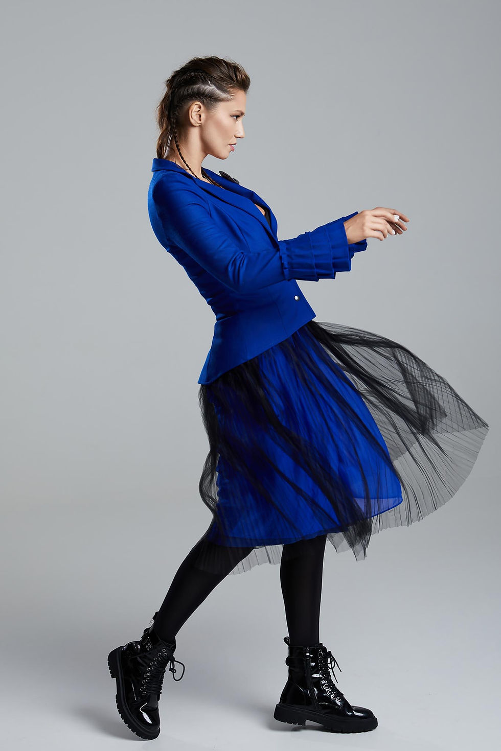 Thumbnail: Hidden Layers Skirt side view with matching Rebel Blue Blazer and in movement