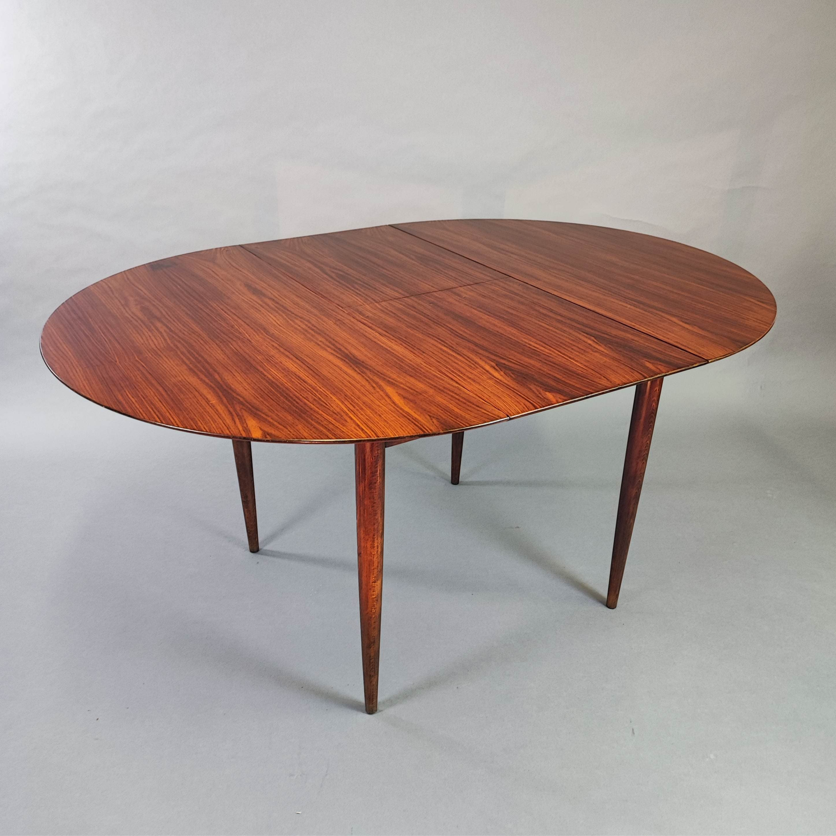 Round extendable table in 1960s design teak