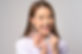 A Young female dentist holding invisalign braces over white background studio, dental heal