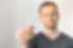 Young handsome man holding dental aligner tooth correction over white background.jpg