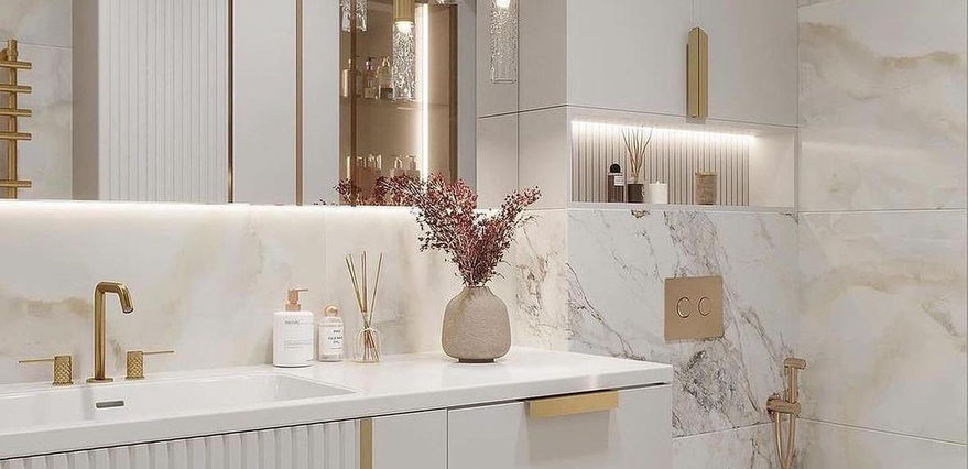 A luxurious design combining marble tiles, built-in shelves, and soft lighting for timeless elegance.