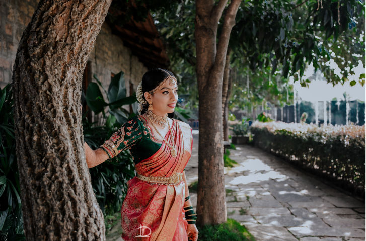 Bride standing alone in elegant pose before wedding ceremony