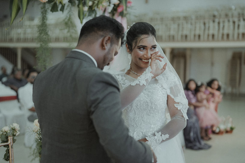 Couple sharing candid smiles during their wedding photoshoot