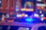 Police car lights at night city street. Red and blue lights.