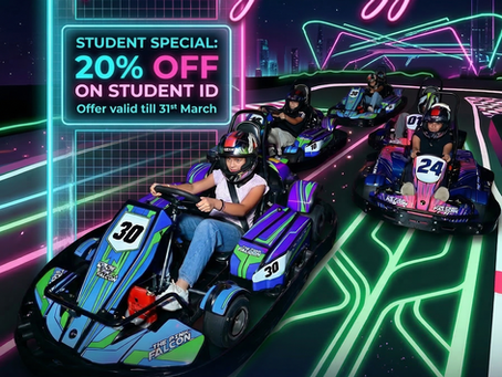 Students riding go karts in our go karting arena