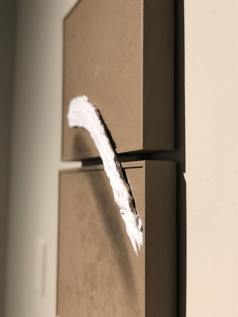 Thumbnail: Floating white paint stroke over two panels 