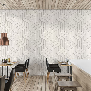 Modern cafe interior with black chairs, wooden tables, light wood flooring, and a Covr Wave Sandstone geometric wallpaper accent wall. Large windows provide natural light, with a copper pendant lamp—ideal wallpaper for restaurant spaces.