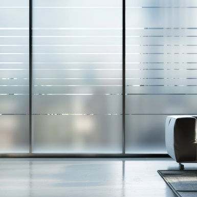 Custom-printed privacy window film in an office with a striped pattern