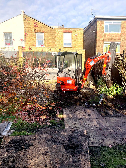 3 Clearing the garden with digger.jpg