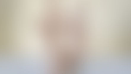 Two wooden dolls represent an autistic couple sharing a gentle, supportive moment together.