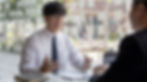 autistic adult sitting and talking with an employer for interview