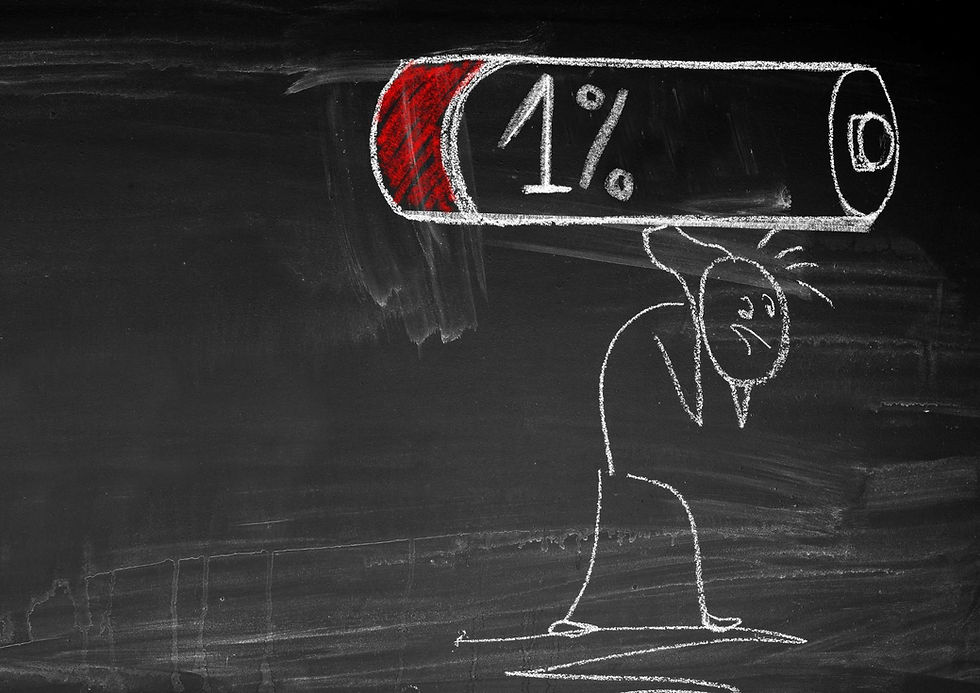 A chalk drawing shows a tired stick figure struggling under a giant low battery icon marked 1%, symbolizing autistic burnout, fatigue, or overwhelm.