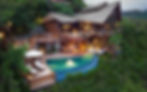 An idyllic view of Six Senses Yao Noi, featuring a luxurious villa with a thatched roof