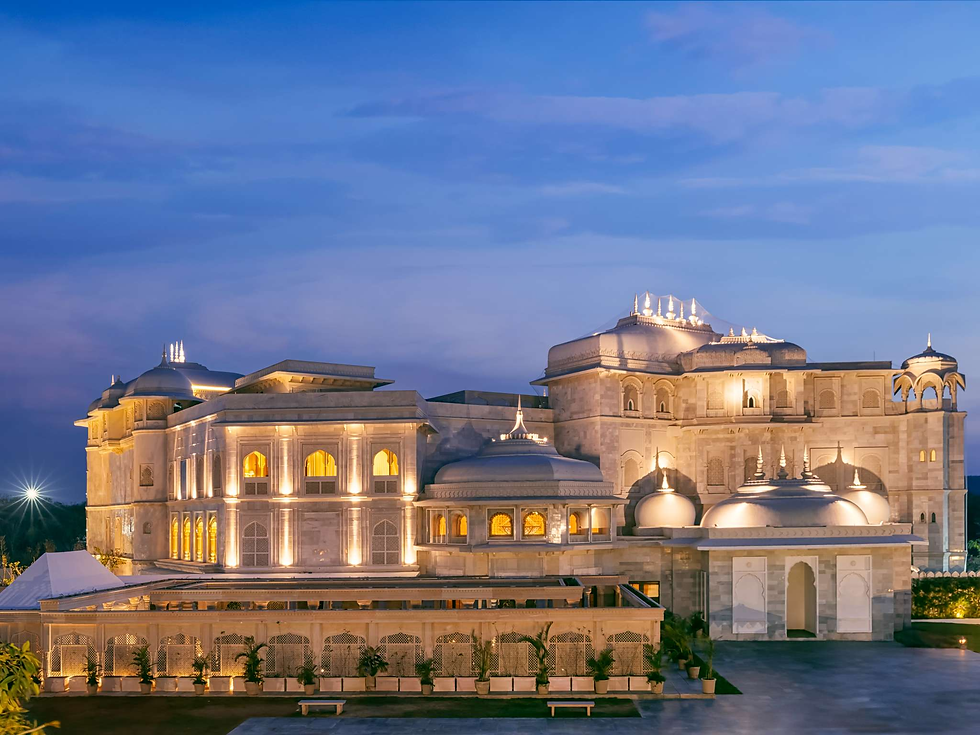 Raffles Jaipur illuminated at dusk, showcasing its magnificent architecture and luxurious design.