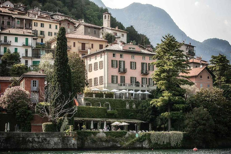 Nestled along a serene waterfront, Relais Villa Vittoria boasts charming historic architecture.