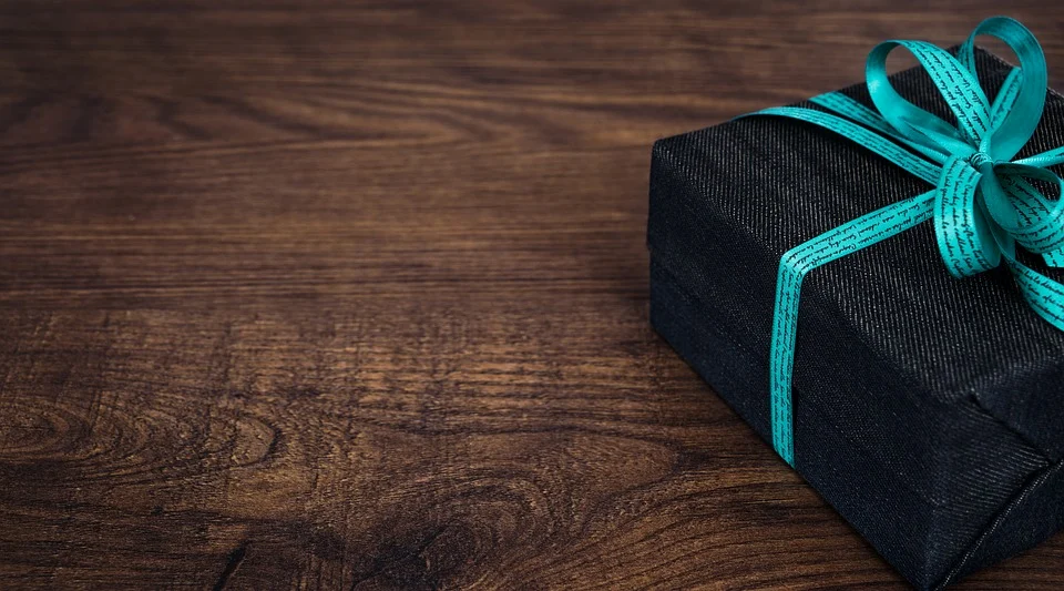 black gift box in a wooden table