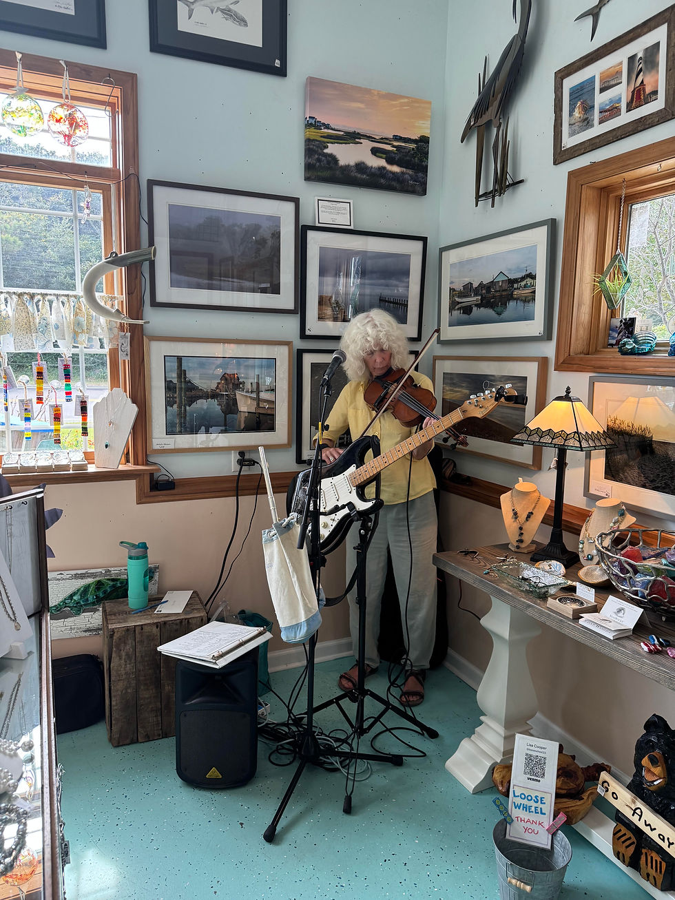 Hatteras musician Lisa Cooper playing at Blue Lagoon in Frisco during Rock The Cape in 2025