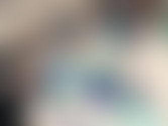 Students work at a table together at Randie Silverstein Glass Studio in Santa Cruz, CA