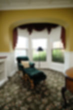 Standard Queen guest room sitting area with bay windows