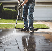 Person power washing a driveway .jpg