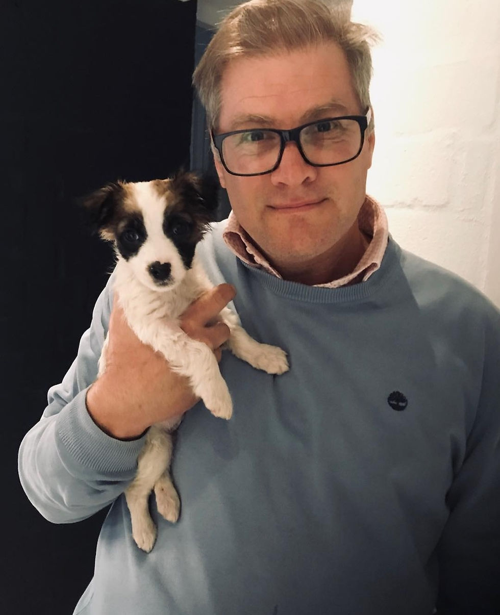 Greg holding Morris as a puppy
