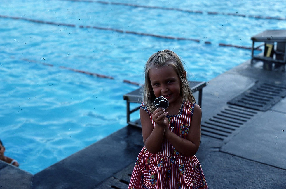 Sally holding up her silver medal